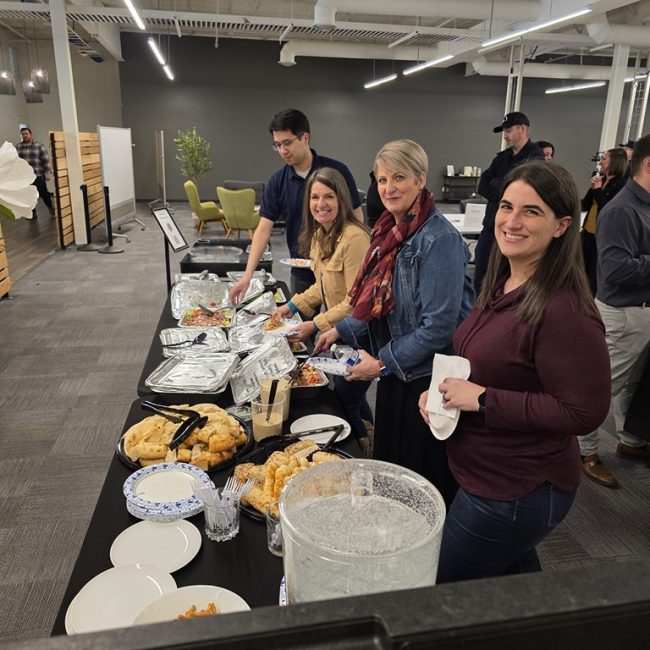 members eating from catering from the supper club